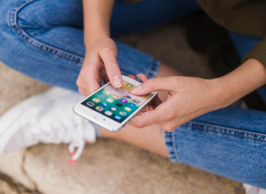 close up woman using mobile phone