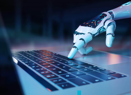 robotic hand pressing keyboard laptop